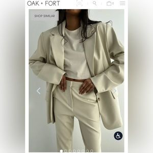 OAK+FORT Vegan leather blazer made in a relaxed fit and has a buttery soft feel.